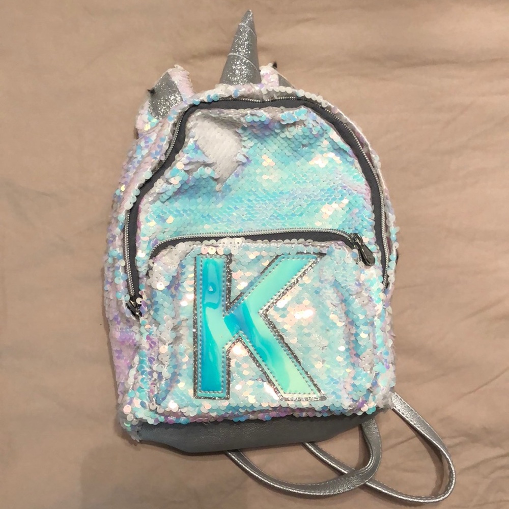Justice sequin mini unicorn back pack “K”
